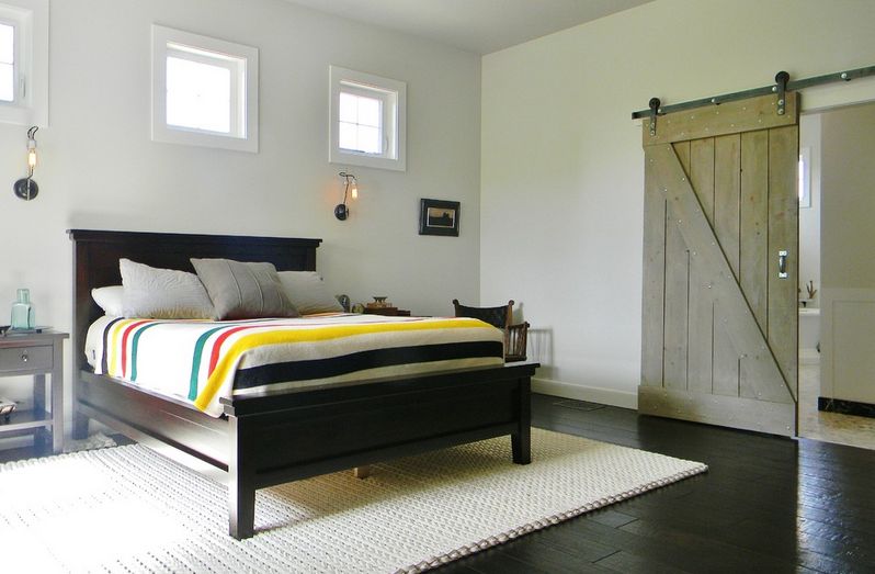 Eclectic interior design with barn door