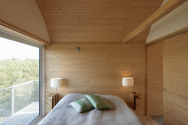corrugated-metal-beach-houses-with-wood-interiors-15-bedroom.jpg
