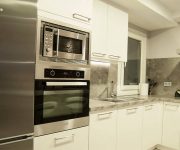 White-gray interior – Kitchen high-tech style – high tech kitchen appliances