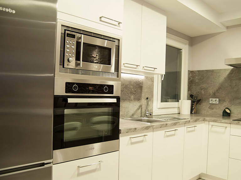 White-gray interior – Kitchen high-tech style – high tech kitchen appliances