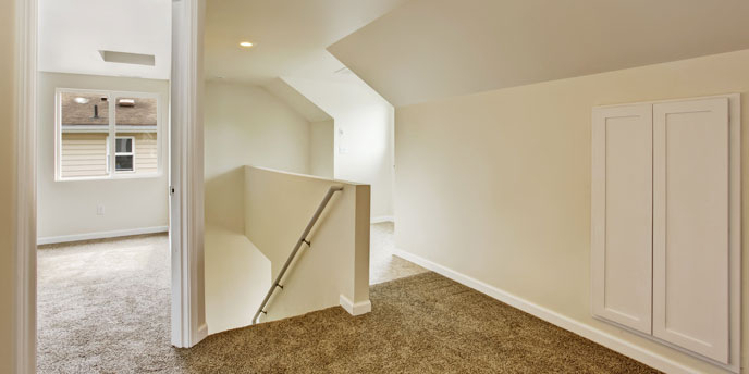 Upstairs Hallway With Door Open to Bedroom